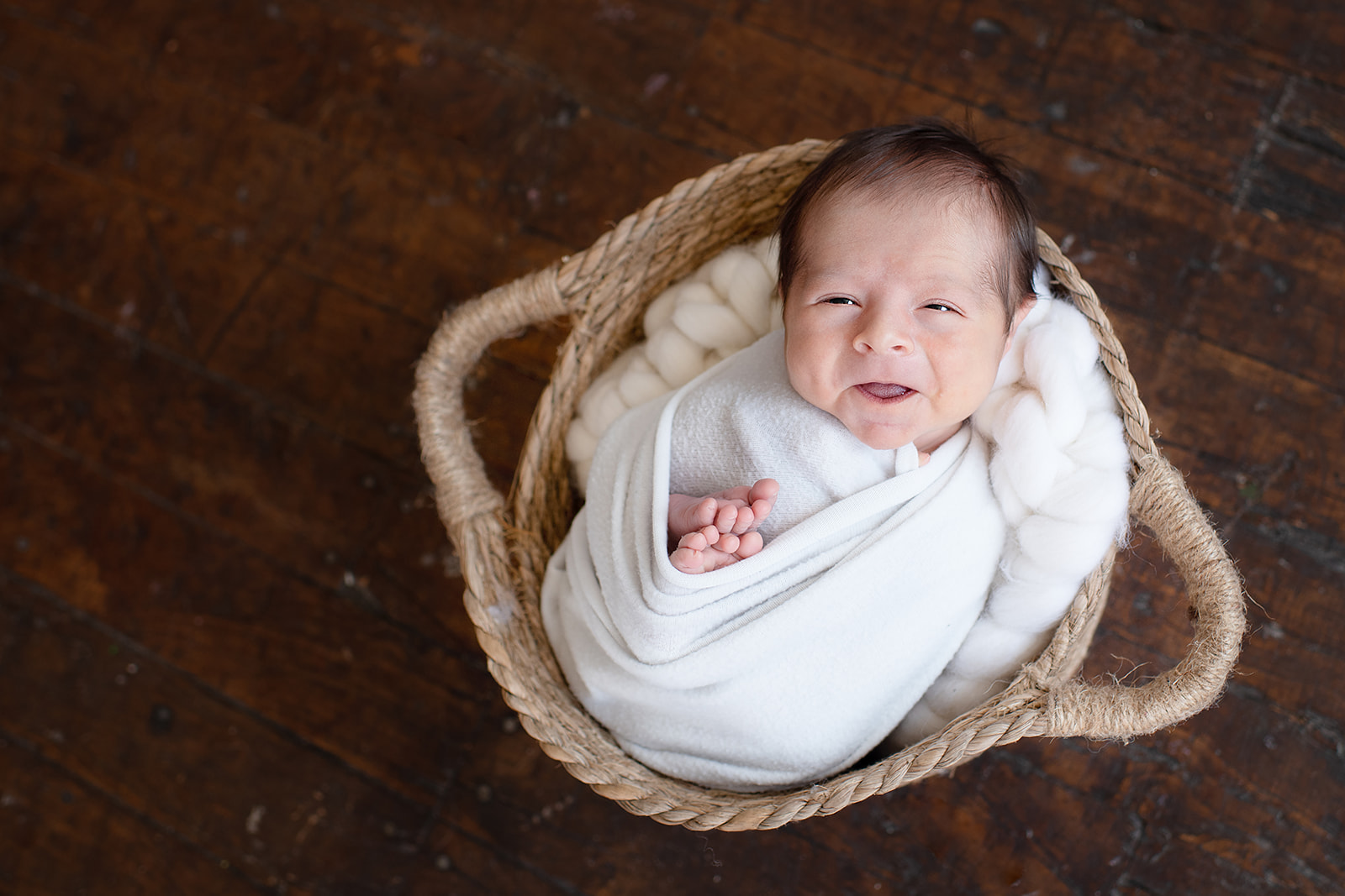 Williamsport pa newborn photographer baby neutral in basket smile